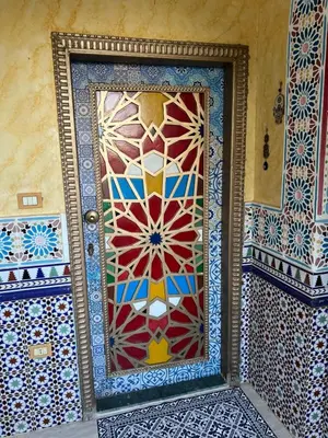 a door with a mosaic design on it in a room at Villa Barba Luxor in Luxor
