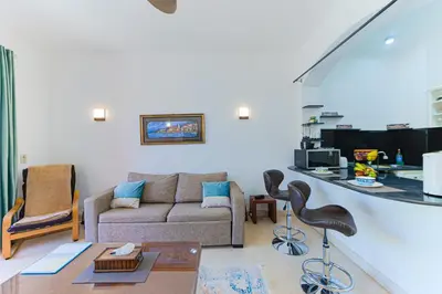 a living room with a couch and a table at Beautiful apartment with terrace to the pool in Hurghada