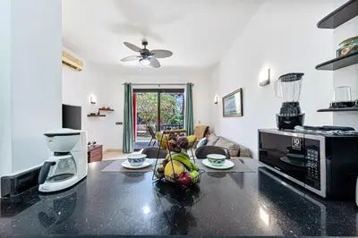 a kitchen with a counter top with a microwave at Beautiful apartment with terrace to the pool in Hurghada