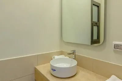 a bathroom with a white sink and a mirror at Sunny 1BR Retreat Newest Project Shedwan El Gouna Lagoon & Pool in Hurghada