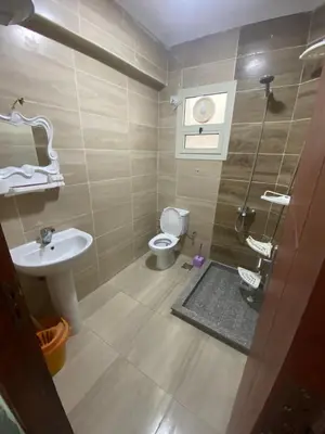 a bathroom with a toilet and a sink at Princess resort 307 in Hurghada