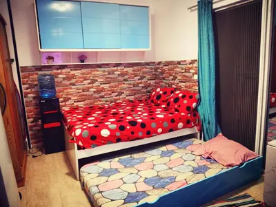 a bedroom with a bed with polka dot sheets at Wavesong Whispers flat where you can enjoy seaview with the best price and enjoy speedy wifi in Hurghada