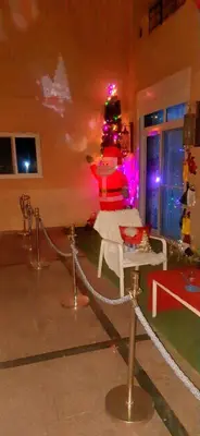 a room with a christmas tree on a table at Wavesong Whispers flat where you can enjoy seaview with the best price and enjoy speedy wifi in Hurghada