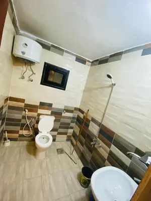 a bathroom with a toilet and a sink at Basmatic2 Nubian Guest House in Aswan