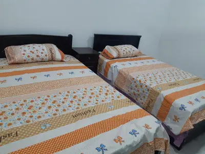 two beds sitting next to each other in a room at الغردقة الدهار القيادات in Hurghada