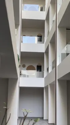 a view of a building with white balconies at Imperial resort in Hurghada