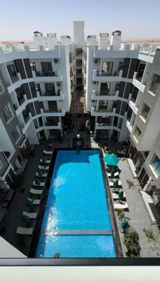 an aerial view of an apartment complex with a swimming pool at Imperial resort in Hurghada