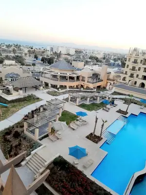 an aerial view of a resort with a pool at ALDAU Heights Mountain View in Hurghada
