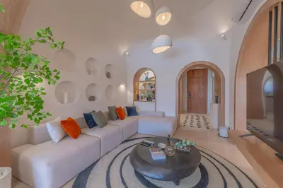 a living room with a white couch and a table at Stunning Luxurious 5 BR Villa at West Golf El Gouna in Hurghada