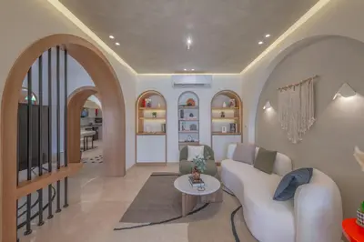 a living room with a white couch and a table at Stunning Luxurious 5 BR Villa at West Golf El Gouna in Hurghada