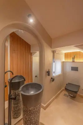 a bathroom with a trash can and a toilet at Stunning Luxurious 5 BR Villa at West Golf El Gouna in Hurghada