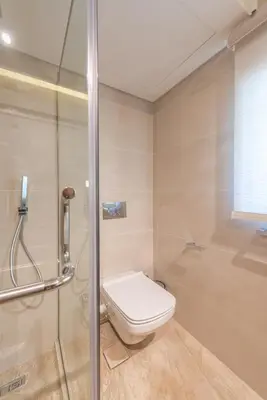 a bathroom with a toilet and a shower at Stunning Luxurious 5 BR Villa at West Golf El Gouna in Hurghada