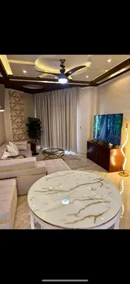 a living room with a couch and a table at Sahl Hasheesh, El Andalous by sea and pool view, private beach in Hurghada