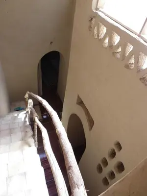 a view of a staircase in a building at maison luxor in Al Aqālitah
