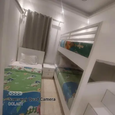 a small room with a bed and a bunk bed at Selena bay resort in Hurghada
