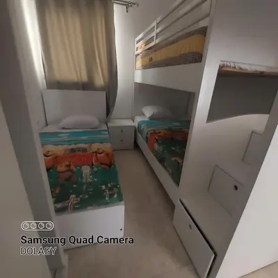 a small room with two bunk beds in it at Selena bay resort in Hurghada
