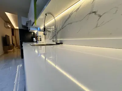 a bathroom with a white counter and a sink at Tolles Modernes Studio in Selena Bay in Hurghada