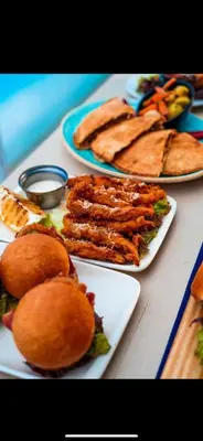 three plates of food on a table with sandwiches at Tolles Modernes Studio in Selena Bay in Hurghada