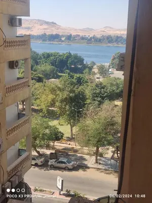 a view of a lake from a building at Super Elite apartment Nile View F6 in Naj‘ al ‘Amrāb