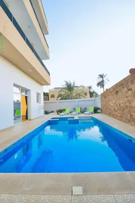 a swimming pool in the middle of a house at Sultan Guest House in Luxor