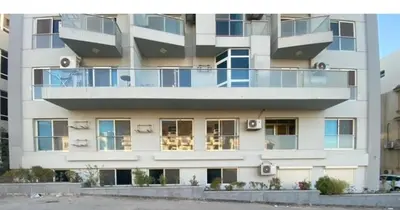 a large white building with balconies on it at Red sea-Cozy one bedroom with sea view in Hurghada