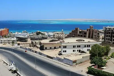 an aerial view of a city with the ocean at Red sea-Cozy one bedroom with sea view in Hurghada