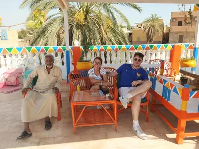a group of three people sitting in chairs at La Veranda \u967d\u53f0 in Aswan