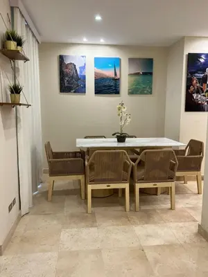 a dining room with a table and chairs at Scarab El Gouna in Hurghada
