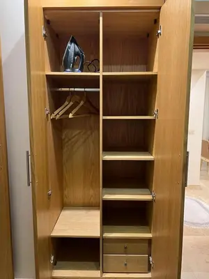 a wooden closet with wooden shelves at Scarab El Gouna in Hurghada