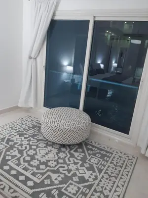 a room with a rug on the floor and a window at Hurghada Stylish stay in Hurghada