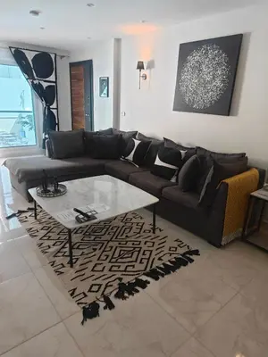 a living room with a couch and a coffee table at Hurghada Stylish stay in Hurghada