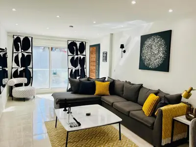 a living room with a couch and a coffee table at Hurghada Stylish stay in Hurghada