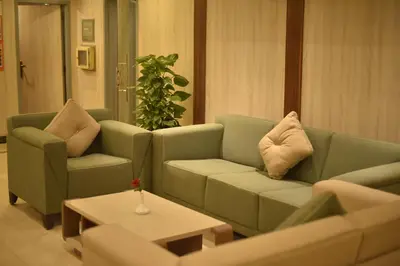 a living room with a couch and two chairs at Hapi V in Aswan