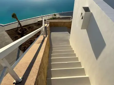 a stairway leading up to a building with a stair case at Penthouse 3 Bedrooms in Swan Lake ElGouna in Hurghada