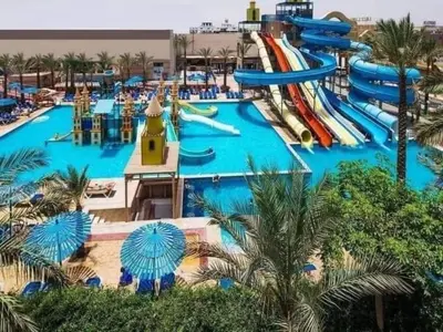 a large water park with a water slide at شاليه في منتجع ميراج in Hurghada