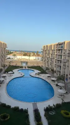 an overhead view of a swimming pool at a resort at Sea View Beach Access Princess Resort Hurghada in Hurghada