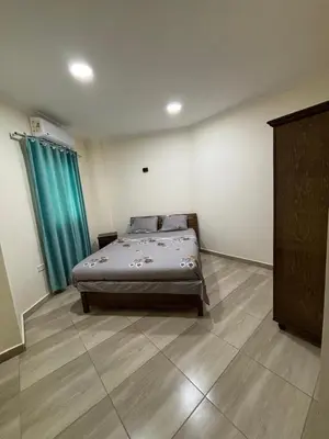 a bedroom with a bed in the corner of a room at Sea View Beach Access Princess Resort Hurghada in Hurghada