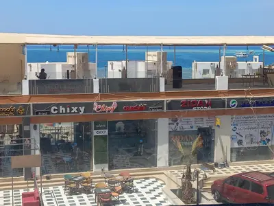a building with a car parked in front of it at شقة فندقية على البحر 3 in Hurghada