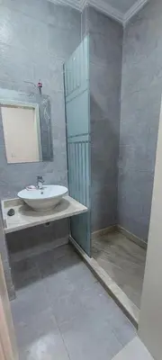 a bathroom with a sink and a mirror at شقة فندقية على البحر 3 in Hurghada