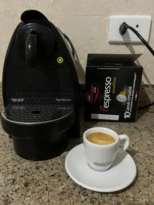 a cup of coffee sitting on a counter next to a coffee maker at Villa du bonheur 202 in Hurghada