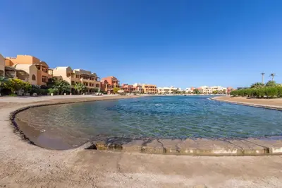 a pool of water in the middle of a beach at Cozy Studio Ground floor in Upper Nubia in Hurghada