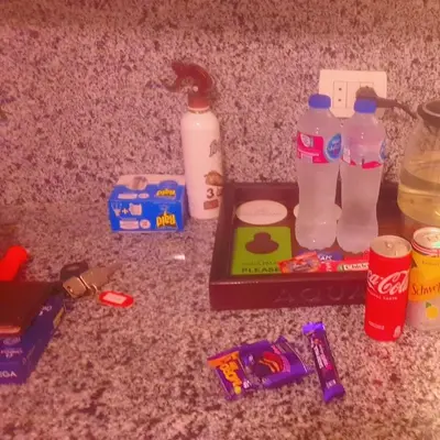 a counter top with a bunch of food and drinks at Hotel Room in Aqua Palms Hurghada in Hurghada