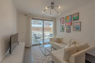 a living room with a couch and a table at New & Chic 2BR with Pool Access Sholan 2 El Gouna in Hurghada
