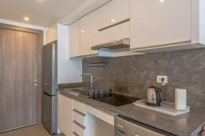 a kitchen with a sink and a counter top at New & Chic 2BR with Pool Access Sholan 2 El Gouna in Hurghada