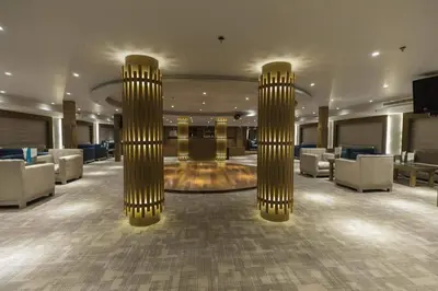 a lobby with two large chandeliers in a hotel at Sofia Nile Cruise Luxor & Aswan in Luxor