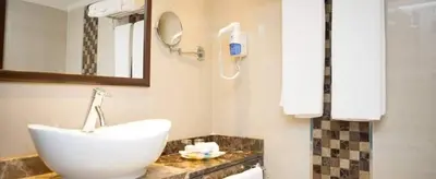 a bathroom with a sink and a mirror at Sofia Nile Cruise Luxor & Aswan in Luxor