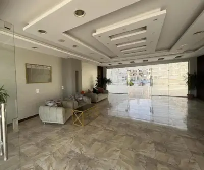 a lobby with couches and tables in a building at princess apartments in Hurghada