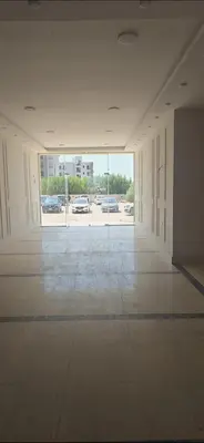 an empty room with cars parked in a parking lot at princess apartments in Hurghada