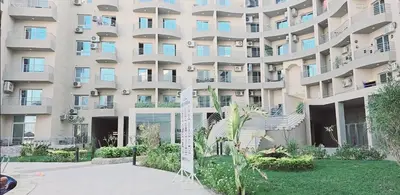 an apartment building with balconies and a courtyard at princess apartments in Hurghada