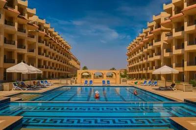a swimming pool in the middle of a hotel at Selena Bay Luxury Sea View 1BR Apartment, Private Beach and Pool in Hurghada
